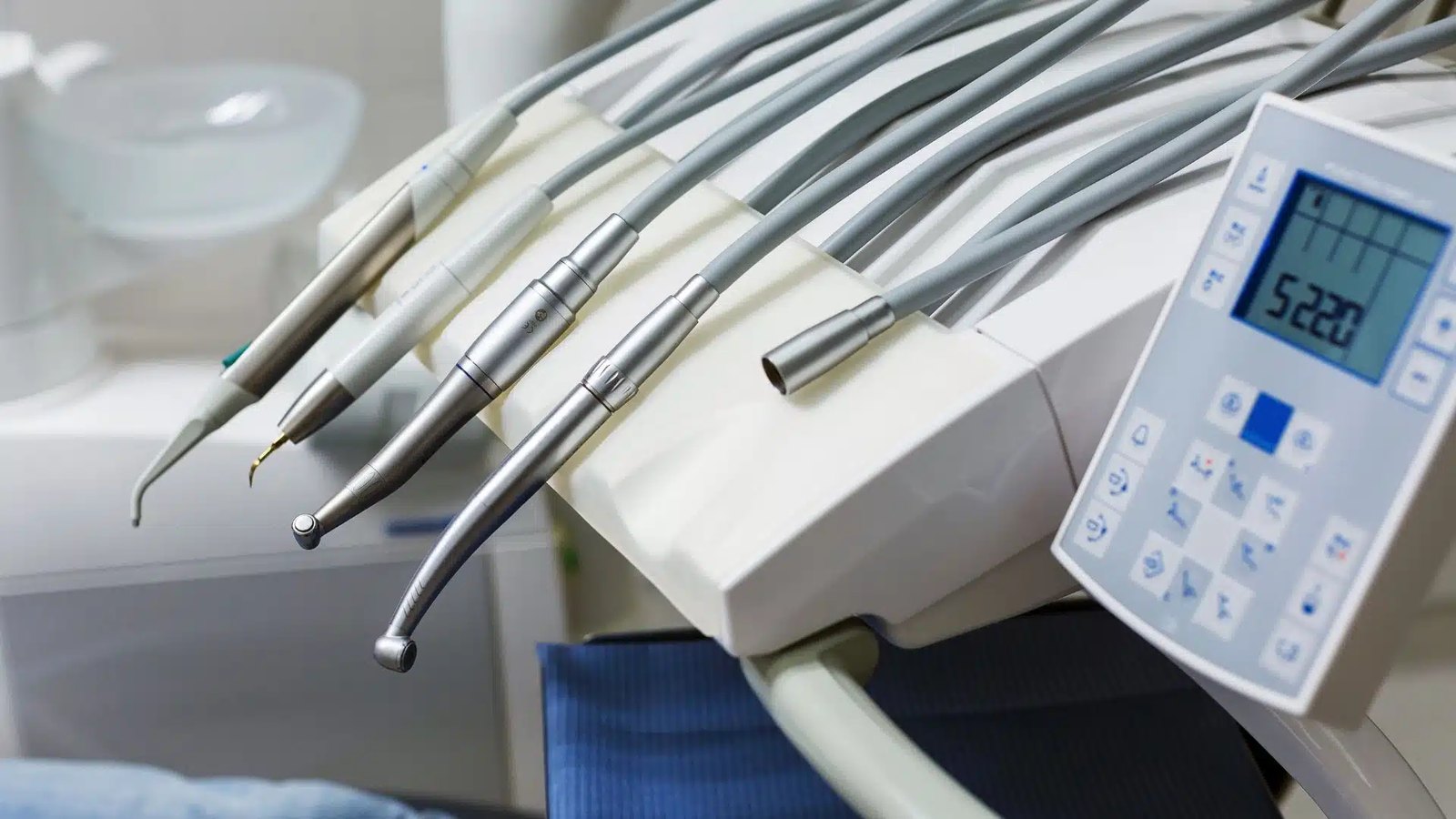 Handpieces in the holders on a dental delivery unit